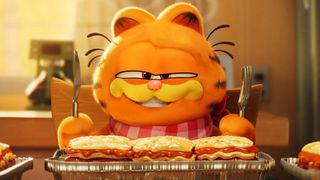 Garfield the cat is about to eat lasagna in The Garfield Movie