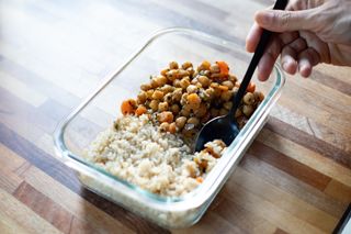 What is protein? A woman eating a chickpea curry