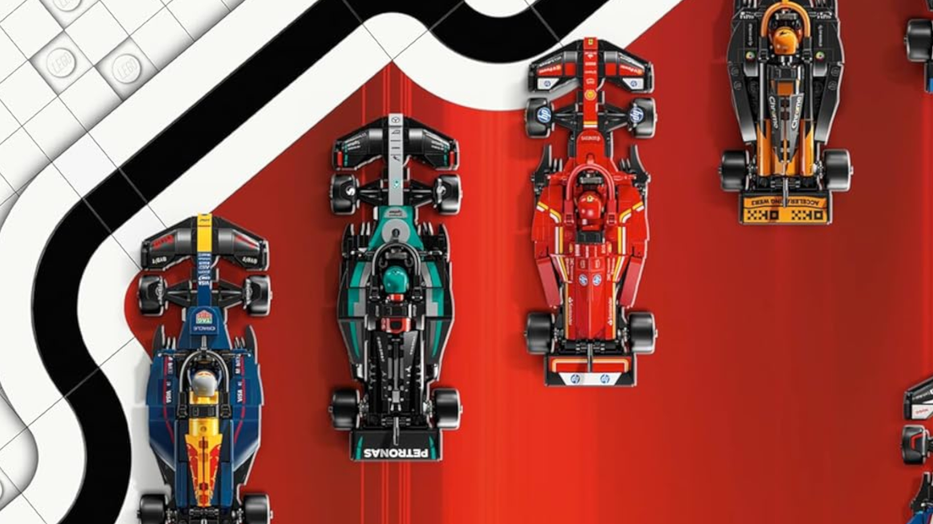 Lego F1 car sets on a red and white background