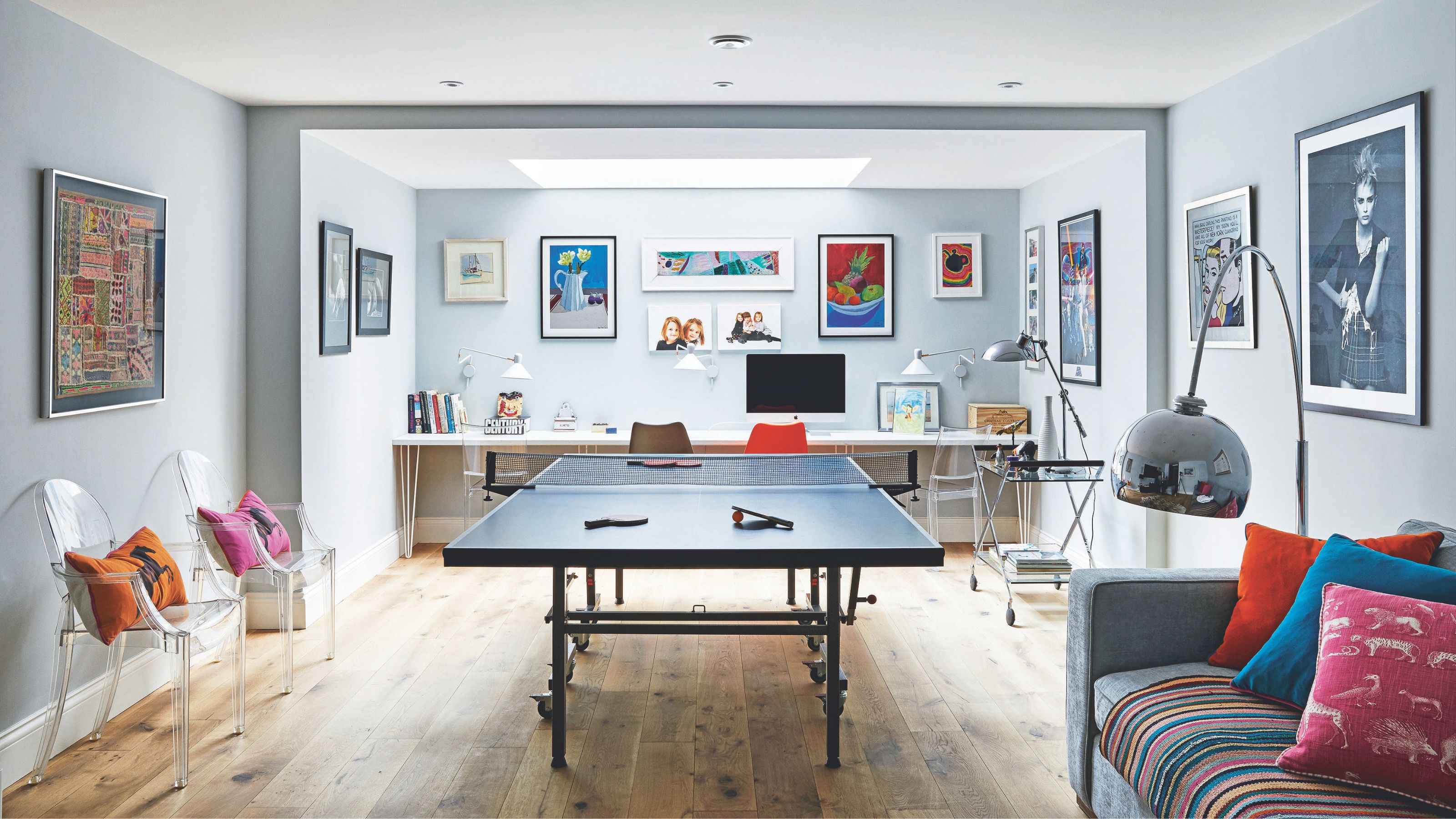 Games room, with a table tennis table and sofa, in a basement conversion
