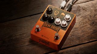 A Keeley D&M overdrive pedal on a wooden floor