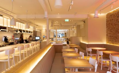 Interior of The Seafood Bar in Soho, London with neutral tones throughout