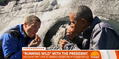 President Barack Obama eats salmon on Running Wild With Bear Grylls.