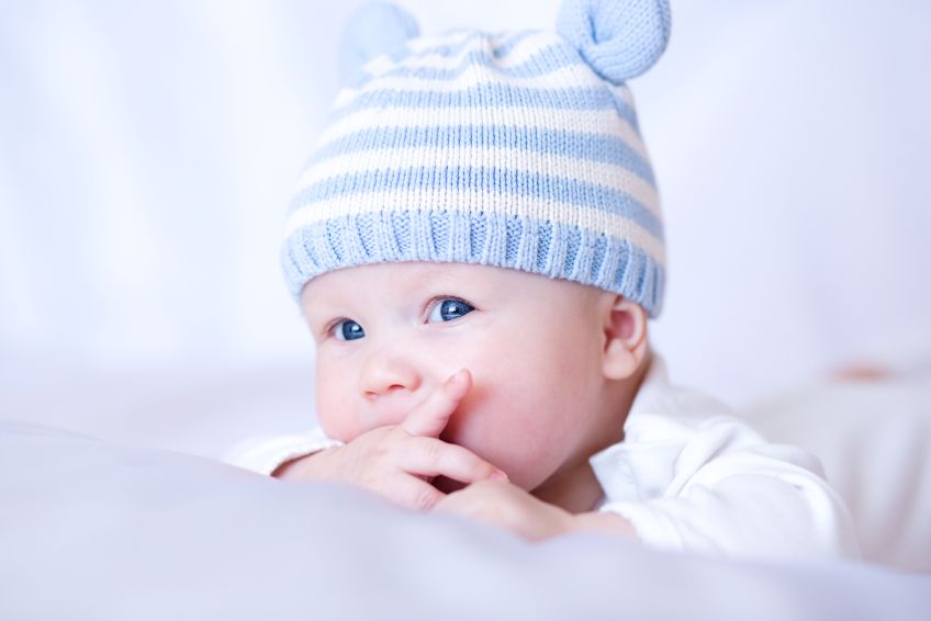 A baby wearing a hat.