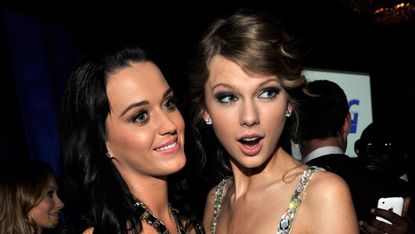Katy Perry and Taylor Swift wearing silver dresses