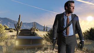 GTA 5 money: Michael holding a gun with a car parked in the desert behind him