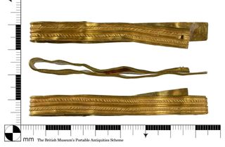 An image of the bracelet against a ruler