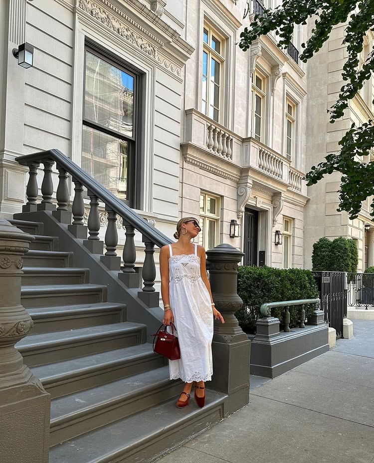 @sofiagrainge wears red velvet Mary Janes with a white cotton dress