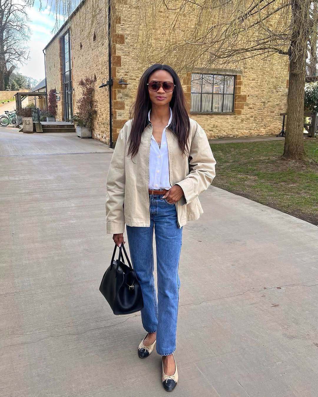 @symphonyofsilk wearing barn jacket and jeans