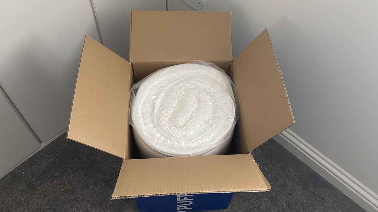 Puffy Deluxe Mattress Topper in its box