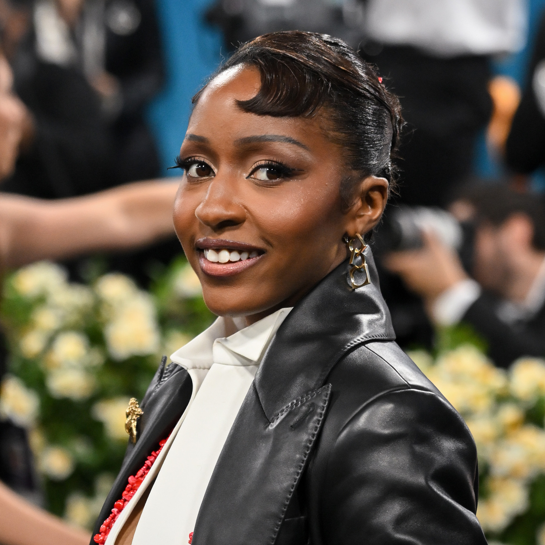 Ayp Edebiri attending the "Superfine: Tailoring Black Style" Met Gala with sleek, winged eyeliner and a glowing complexion