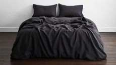 Black bedding sets on bed in bedroom lifestyle image