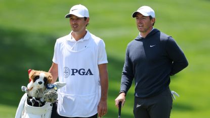 Rory McIlroy and Harry Diamond during the first round of the 2023 PGA Championship
