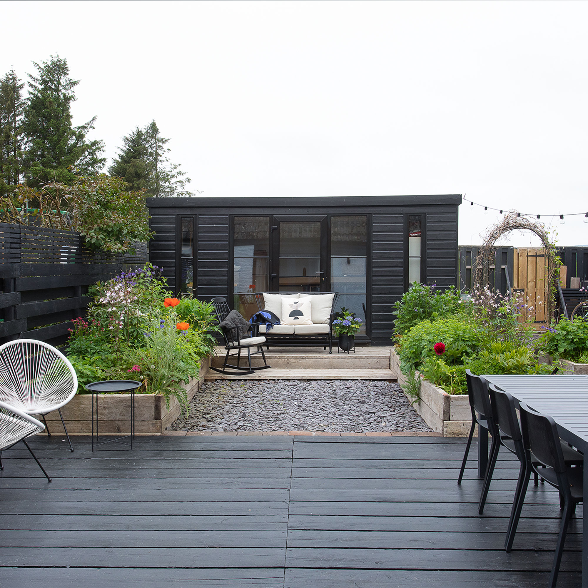 garden with black painted summerhouse