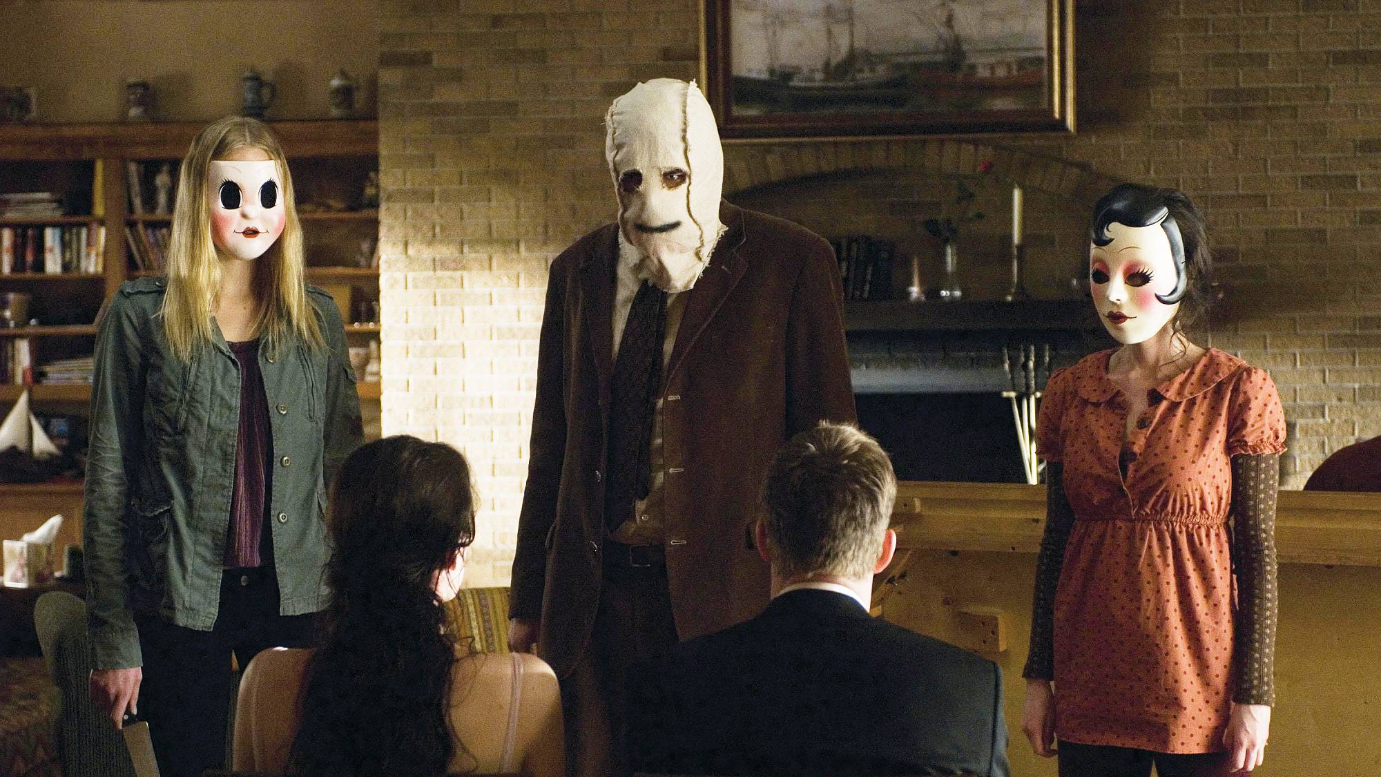 Gemma Ward as Dollface with Kip Weeks as The Man in the Mask, Laura Margolis as Pin-Up Girl, Liv Tyler as Kristen McKay and Scott Speedman as James Hoyt in "The Strangers" movie (2008)