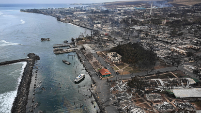 An aerial image taken on August 10, 2023 shows destroyed homes and buildings burned to the ground in the historic Lahaina in the aftermath of wildfires in western Maui in Lahaina, Hawaii. At least 36 people have died after a fast-moving wildfire turned Lahaina to ashes, officials said August 9, 2023 as visitors asked to leave the island of Maui found themselves stranded at the airport. The fires began burning early August 8, scorching thousands of acres and putting homes, businesses and 35,000 lives at risk on Maui, the Hawaii Emergency Management Agency said in a statement. 