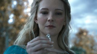 Galadriel (Morfydd Clark) holds one of the rings in "The Rings of Power" season 2