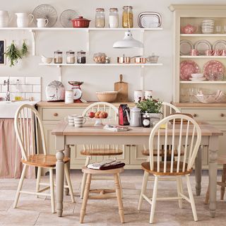 shabby chic kitchen with farmhouse table and chairs