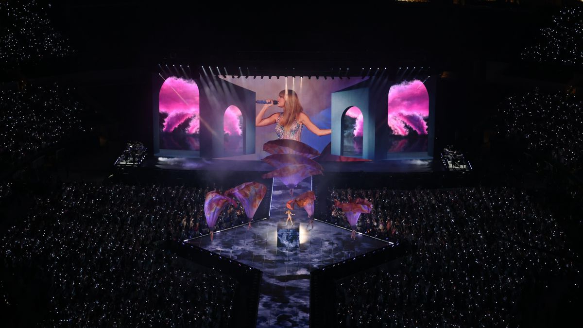 A still from the Eras Tour (Taylor&#039;s Version) on Disney plus with Taylor Swift on stage surround by a large crowd