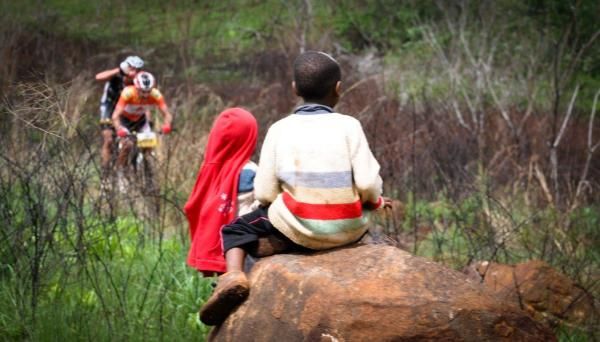 Some locals in rural Zululand look on as Max Knox powers away