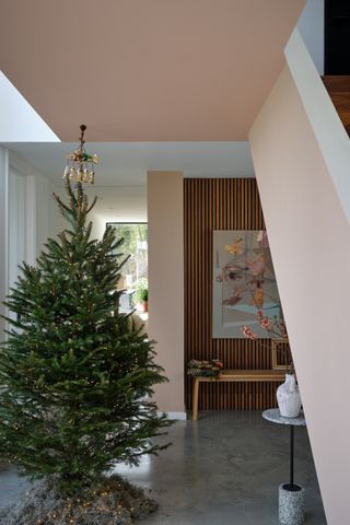 Christmas entryway with Christmas tree by Farrow & Ball