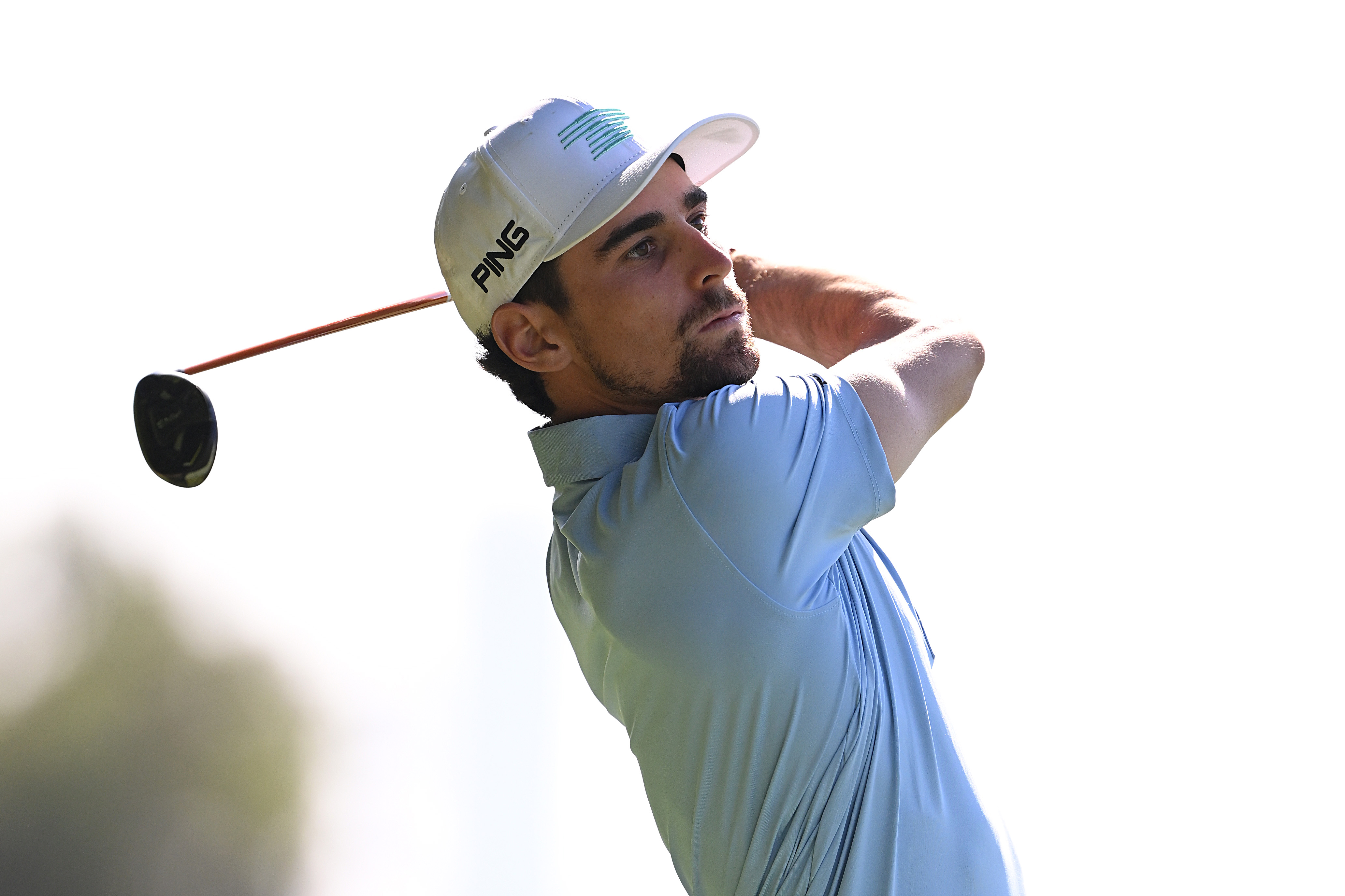 Joaquin Niemann holds his finish on a hybrid shot