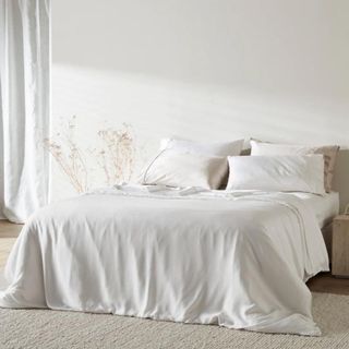 Twill Duvet Cover on a bed against a white wall.