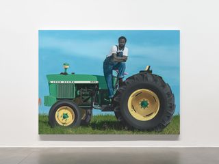 Artwork of a man standing on a tractor