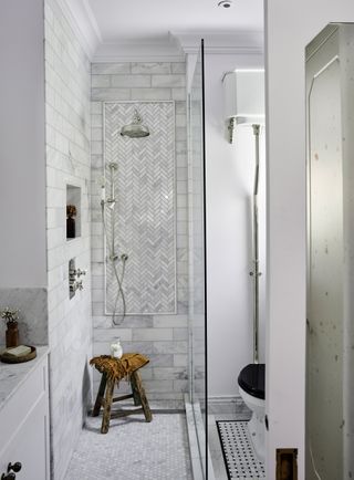 a bathroom with a mosaic tile floor