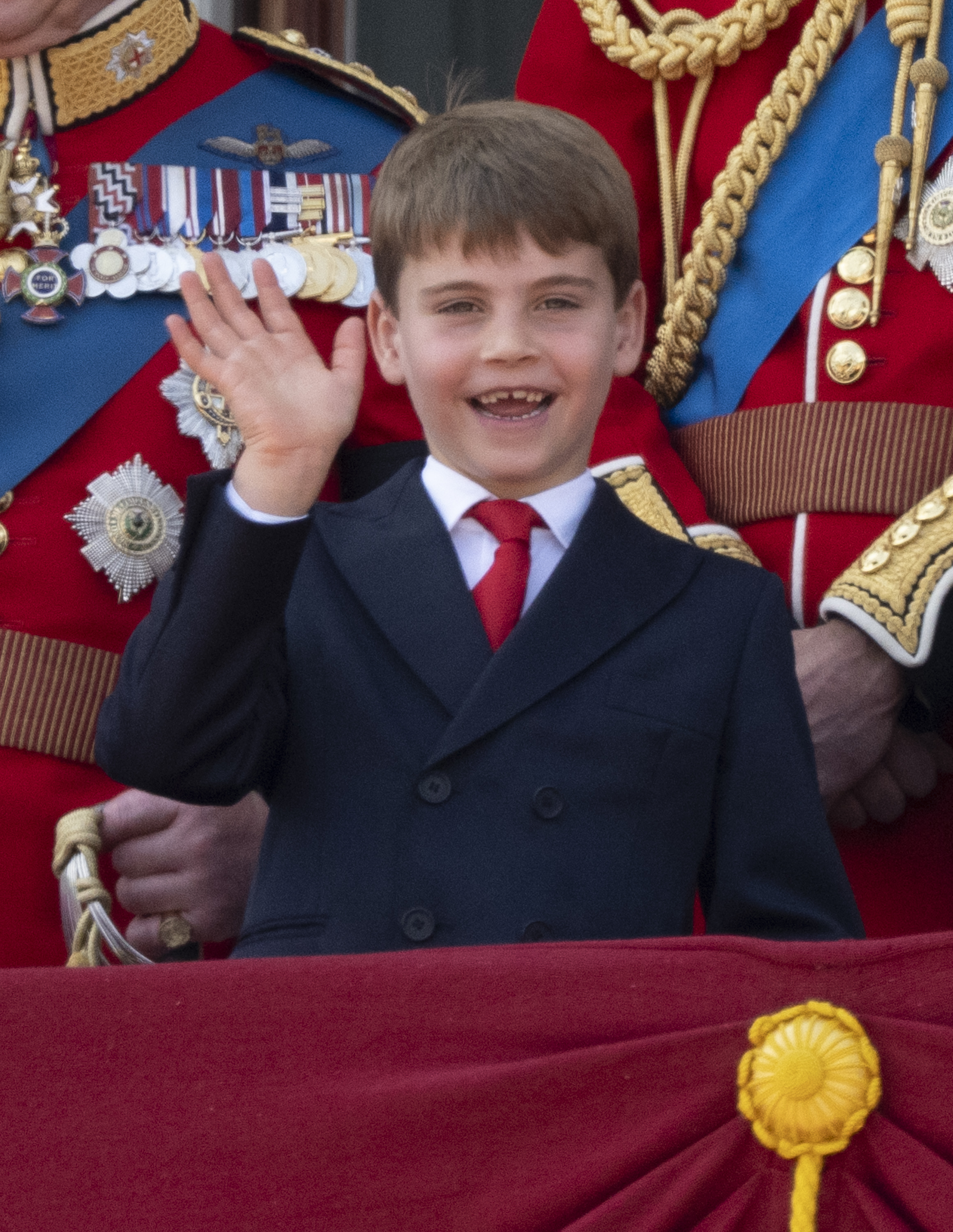 Prince Louis wearing a suit and waving at Trooping the Colour 2025
