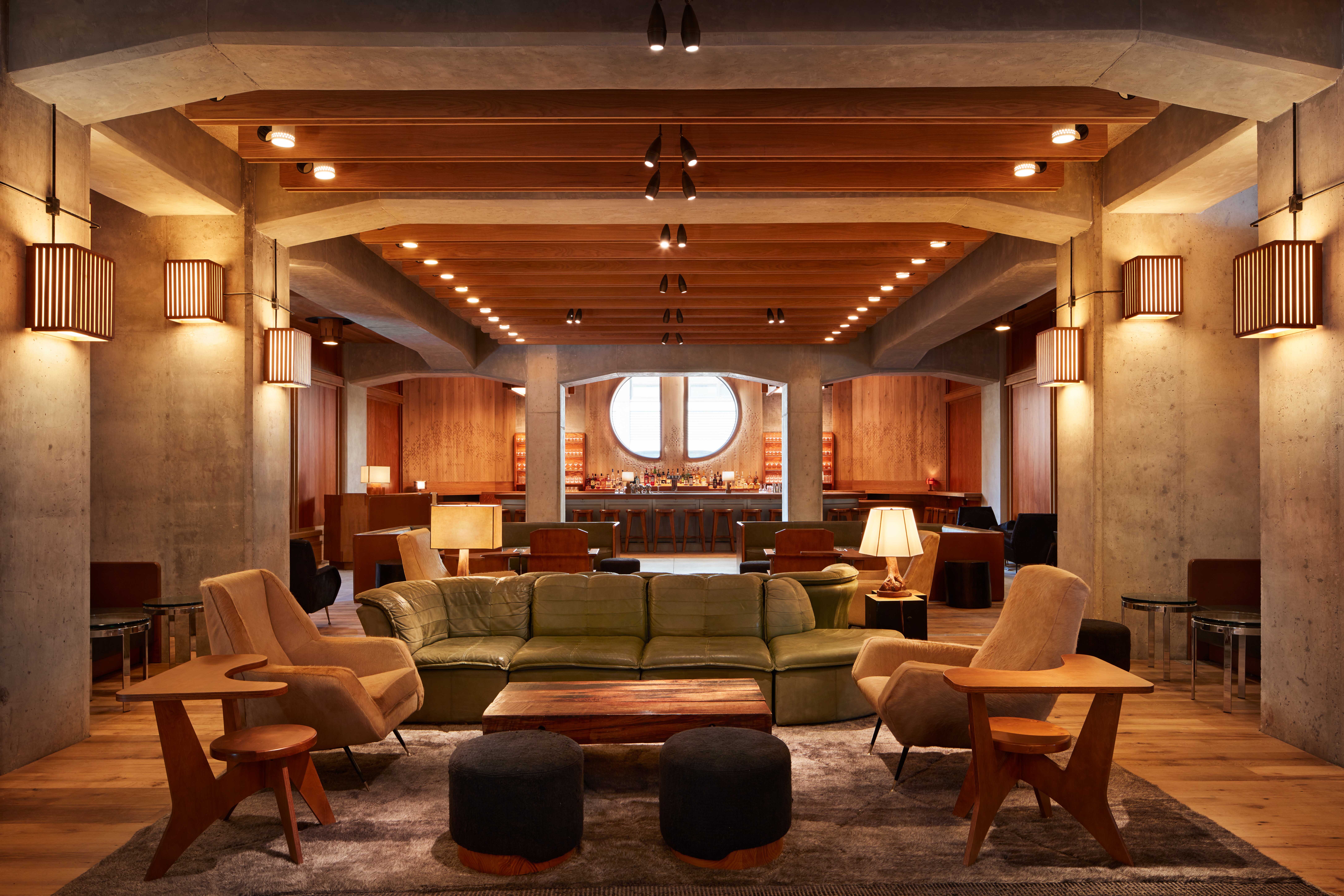 Brutalist-style hotel interior with mid-century furniture