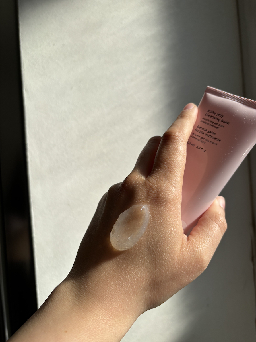 Swatch of the Glossier Milky Jelly Cleansing Balm on back of hand