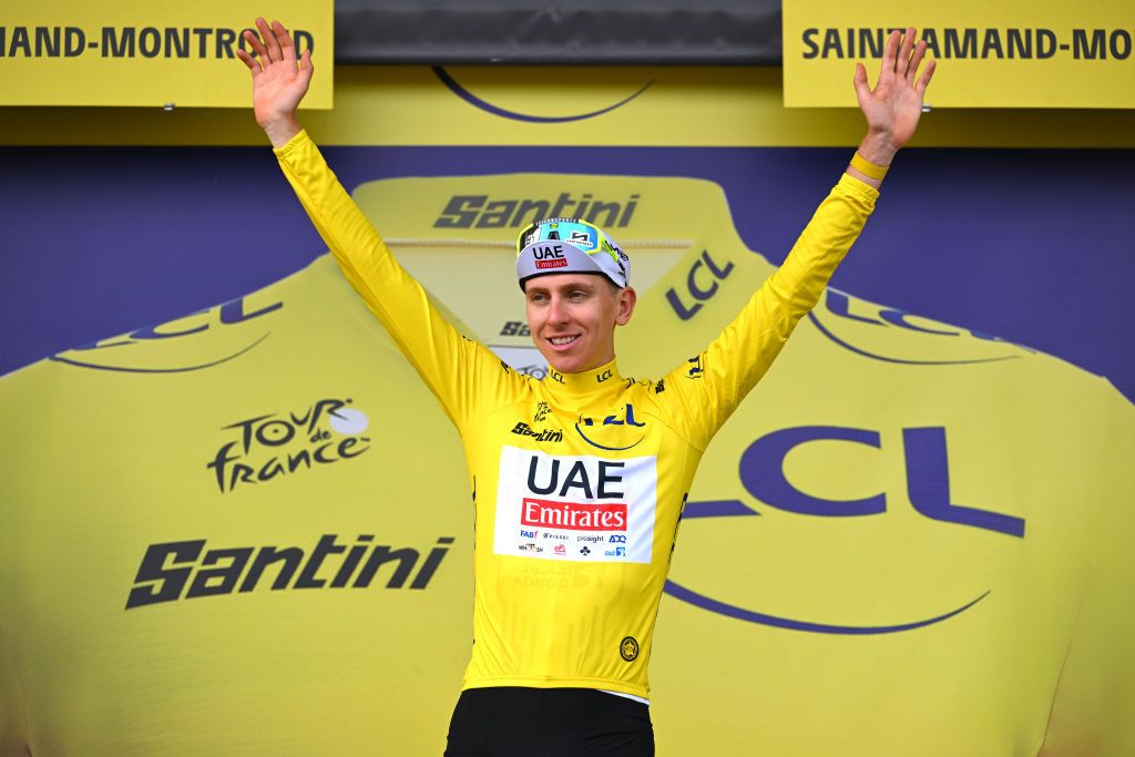 SAINTAMANDMONTROND FRANCE JULY 09 Tadej Pogacar of Slovenia and UAE Team Emirates Yellow Leader Jersey celebrates at podium during the 111th Tour de France 2024 Stage 10 a 1873km stage from Orleans to SaintAmandMontrond UCIWT on July 09 2024 in Orleans France Photo by Tim de WaeleGetty Images