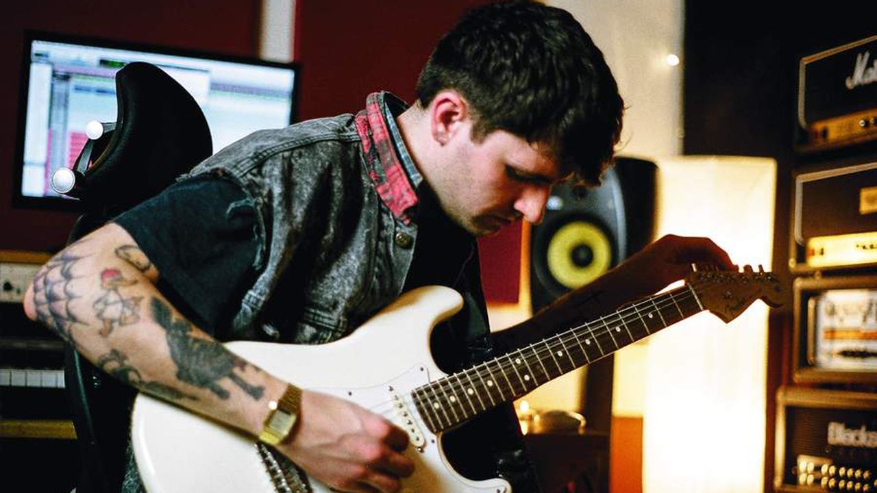 Mike Duce with a Strat, among friends, in his own studio - a happy man