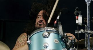 Grohl is back behind the kit with Queens