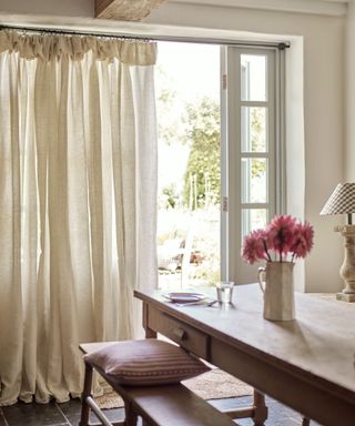 sheer linen curtains with a top ruffle in a country kitchen