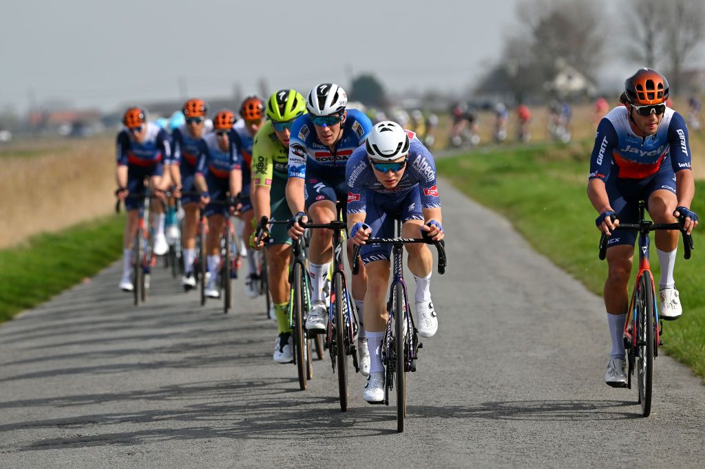 DE PANNE BELGIUM MARCH 20 LR Ayco Bastiaens of Belgium and Team SoudalQuick Step Juri Hollmann of Germany and Team AlpecinDeceuninck and 13compete during the 48th Classic BruggeDe Panne 2024 Mens Elite a 1989km one day race from Brugge to De Panne UCIWT on March 20 2024 in De Panne Belgium Photo by Luc ClaessenGetty Images