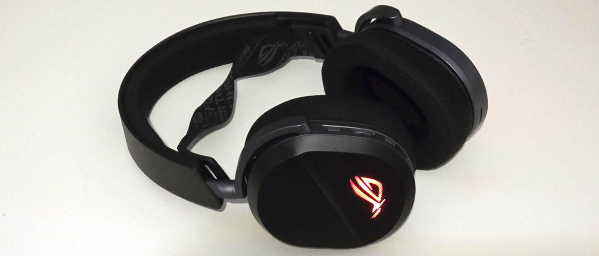 The Asus ROG Pelta gaming headset lying on a table with the microphone removed