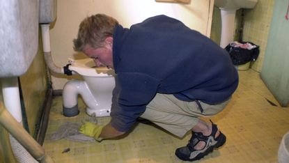 William Cleaning Toilet