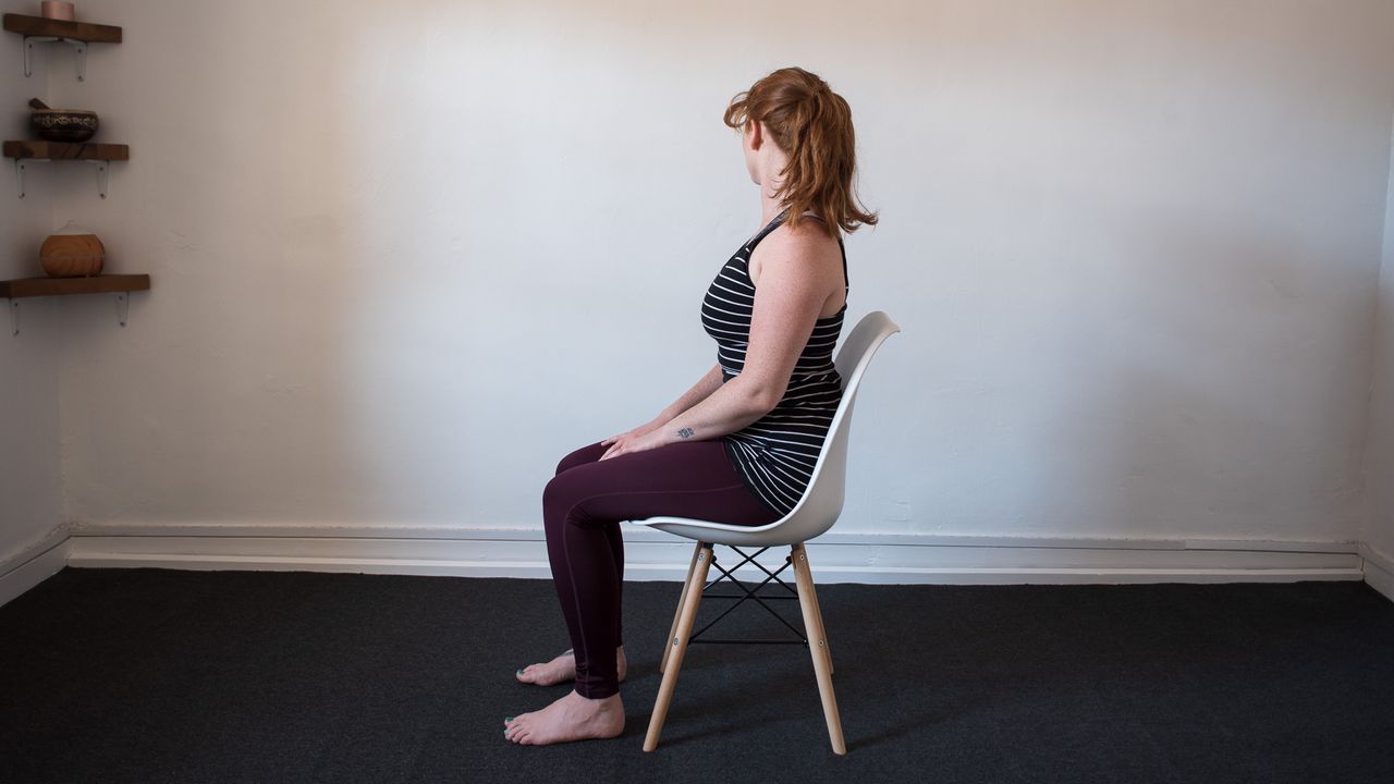 desk exercises: seated woman with head turned to the right