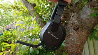 The Turtle Beach Stealth 600 gaming headset outside with the microphone and buttons on show.
