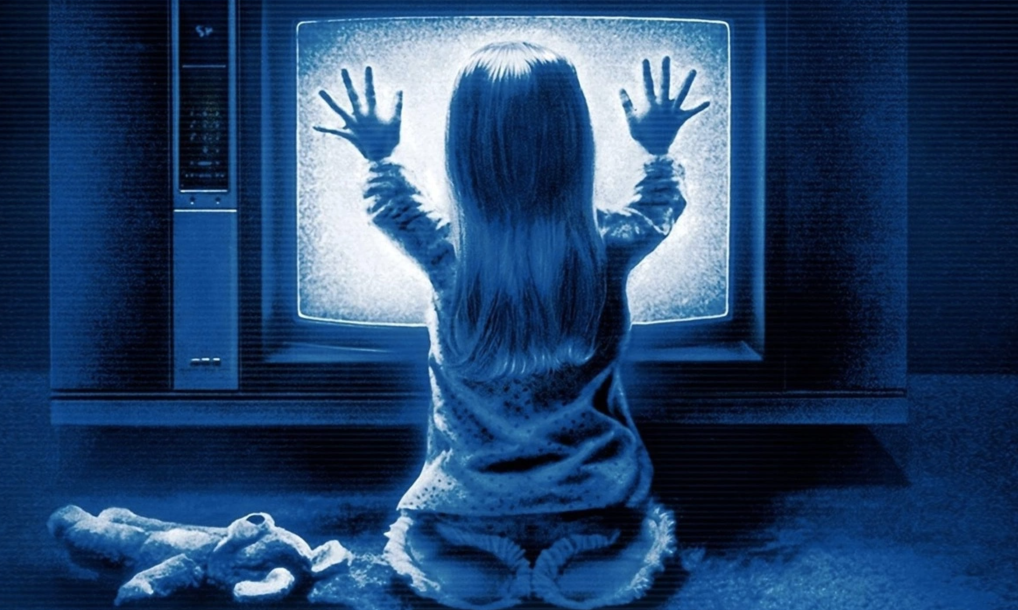 Poltergiest promo image showing a little girl in front of the TV
