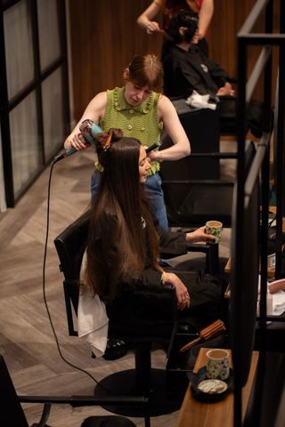 Dionne Brighotn getting hair done