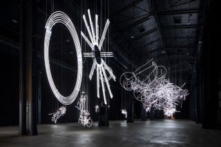 Cerith Wyn Evans 'the Illuminating Gas', exhibition view at Pirelli HangarBicocca in Milan, a former train factory