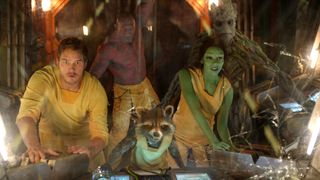 (L to R) Chris Pratt as Star-Lord, Dave Bautista as Drax, Bradley Cooper as Rocket Raccoon, Zoe Saldaña as Gamora and Vin Diesel as Groot in a ship cockpit in Guardians of the Galaxy