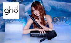 GHD logo placed over an image of a model posing with GHD products in a icy themed room