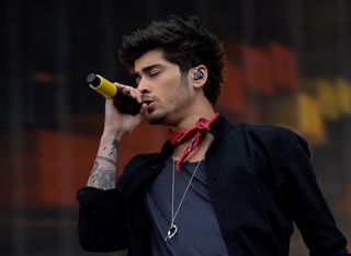 One Direction's Zayn Malik performing on stage