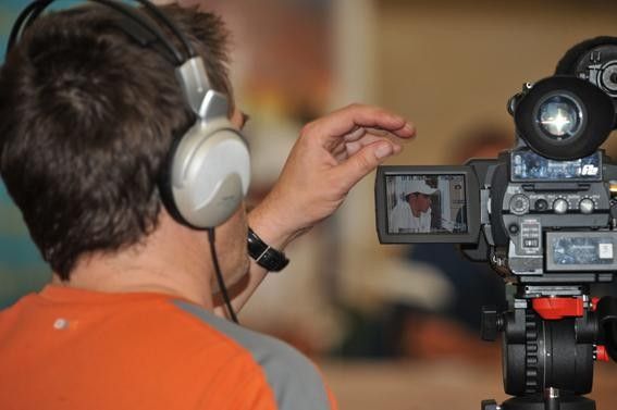The cameraman films Contador as he answers reporters' questions.