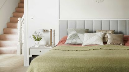 bedroom with green and pink bedding