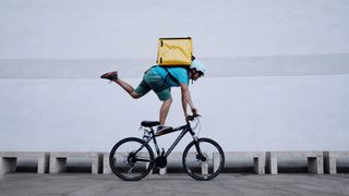 Man balancing on bike